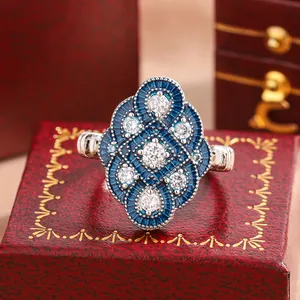 Close-up macro view of a vintage European style ring with blue enamel and crystal stones