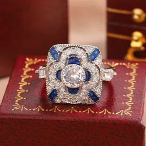 Detailed close-up of vintage Art Deco ring with blue and white zirconia stones