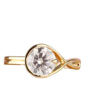 Elegant minimalist gold plated moissanite ring featuring a unique twisted geometric band