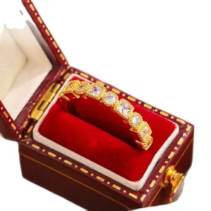 Vintage gold-plated lace row ring with sparkling cubic zirconia in red velvet box