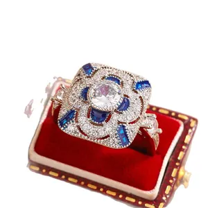 Vintage silver-tone wedding ring with large white zirconia and blue accent stones