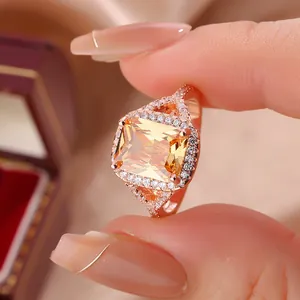 Macro view of a luxury rose gold ring with a large rectangular champagne zircon stone