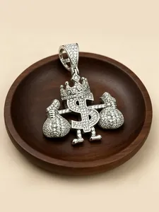 Detail of an iced-out silver dollar sign pendant with crown and money bags