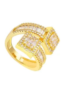 Close-up detail of a gold adjustable ring with square baguette zircon clusters