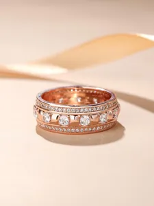 Detailed macro view of luxury 18K rose gold plated eternity ring with pave set stones