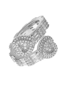 Detailed macro view of silver iced out double heart hip hop ring with baguette stones