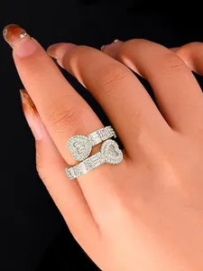 Detailed view of a shimmering silver heart-shaped ring with pavé diamond accents.