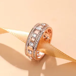 Luxury 18K rose gold plated band ring with sparkling pavé crystals and elegant wide design