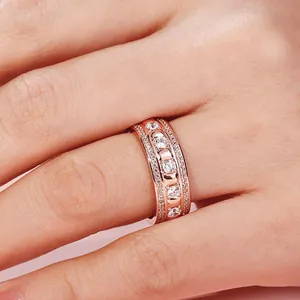 Luxurious 18K rose gold plated ring with sparkling cubic zirconia on finger