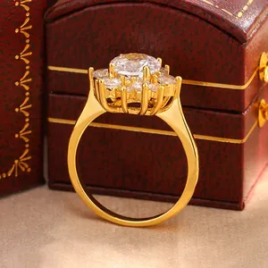 Macro view of golden sunflower ring with sparkling cubic zirconia stones.