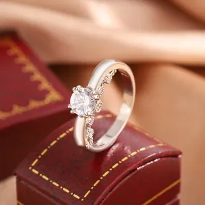 Detailed macro view of a silver four-prong ring featuring a large sparkling zircon