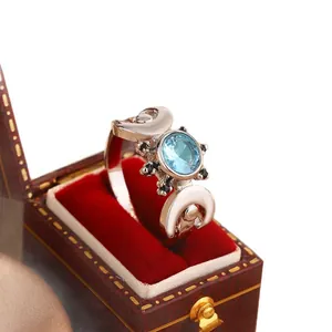 Elegant 18K gold plated ring featuring a blue zircon center and white crescent moon accents