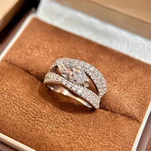 Detailed view of a luxury micro-paved zircon ring with marquise-cut center stone.
