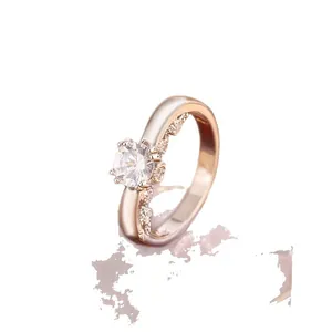 Elegant rose gold plated ring with a large central zircon in a four-prong setting