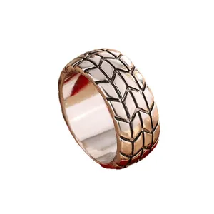 Masculine tire tread pattern ring with metallic finish in a wide 6mm band design.