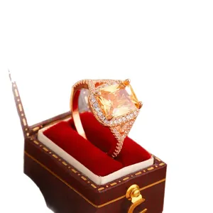 Rose gold engagement ring featuring a square yellow zircon and micro-pave accents.