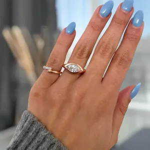 Stunning 18k gold plated marquise cut lab diamond ring on hand with blue nail art