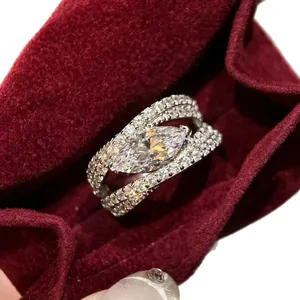 Elegant micro-paved marquise cut zircon open ring displayed in a red velvet jewelry pouch