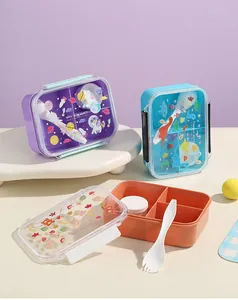 Detailed view of colorful 3-compartment cartoon plastic lunch boxes with lids and spoon