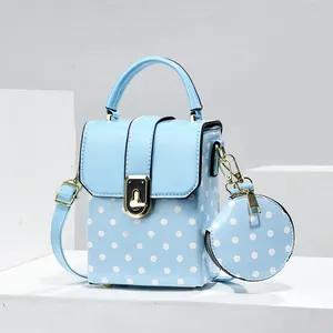 Fashionable light blue polka dot small square crossbody bag with matching round purse