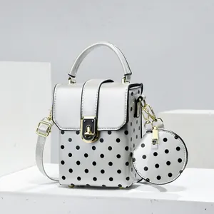Stylish silver polka dot crossbody bag with matching round coin purse for women