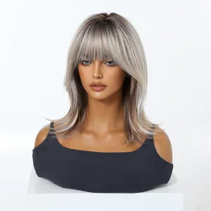 Detailed view of ombre ash blonde synthetic wig with bangs and shoulder-length style.