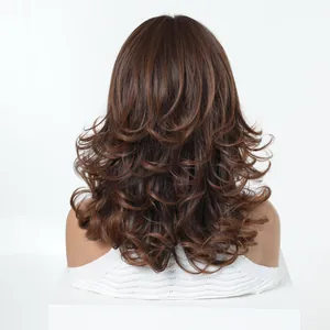 Back view of a wavy brown synthetic wig with natural layered curls on a mannequin.
