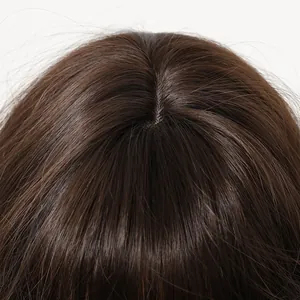 Close-up of realistic scalp parting on dark brown synthetic wig with natural hair texture