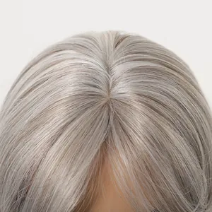 Detailed close-up showing the natural hair scalp parting on a silver gray synthetic wig