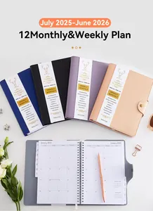 Detail view of A5 spiral planner with tabbed monthly pages and PU leather covers