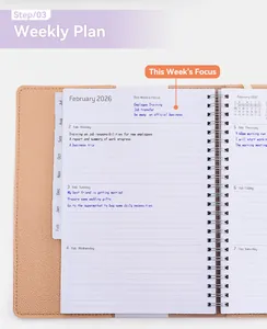 Detail view of A5 PU leather spiral weekly planner showing interior 2026 schedule pages.