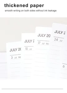 Close-up of thickened white paper pages for 2023 English weekly monthly planner.