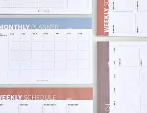 Detailed macro view of assorted colorful weekly and monthly tear-off planner pads