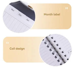 Detailed view showing the month labels and metal coil binding of an A5 planner notebook.