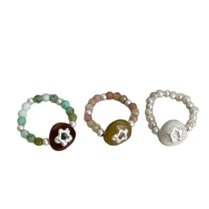 Handmade natural stone and pearl elastic rings with star-shaped floral charms set of 3