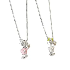 Elegant silver-toned chain necklace with pink and white oil-dripped flower pendants.