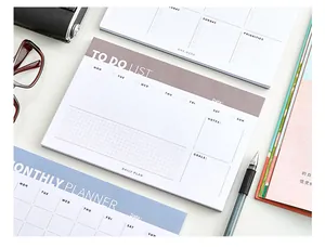 Collection of minimalist daily to-do lists and monthly planner tear-off paper notepads
