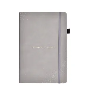 Minimalist gray PU leather business notebook with This Moment IS Eternity gold foil text.