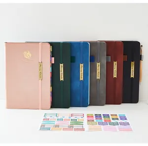 Selectie kleurrijke kunstlederen planners met kalenderstickers