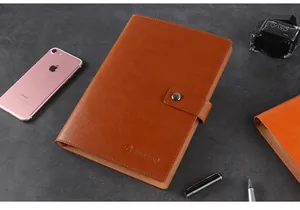 Close-up of premium brown leather A5 business binder notebook with metal snap button