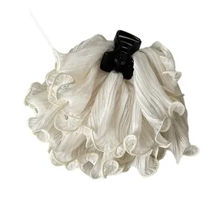 Large white ruffled fabric hair claw clip for elegant hairstyles