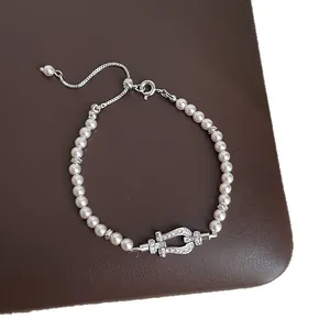 Elegant pearl bracelet with sparkling U-shaped buckle and adjustable chain for women