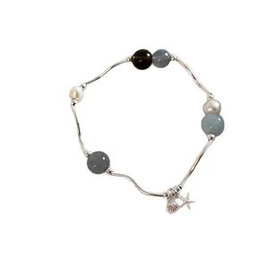 Elegante pulsera elástica de piedra natural con estrella de mar y concha tubos plateados
