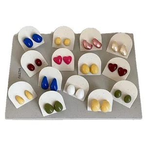 Collection of colorful dopamine enamel stud earrings in geometric bean and heart shapes