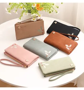 Women's long PU leather wallets in multiple colors with floral accents and wrist straps