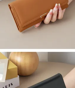 Close-up detail showing the smooth texture of an elegant minimalist long leather clutch for women