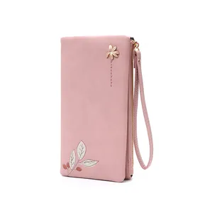 Detail view of pink PU leather long wallet with elegant leaf print and wrist strap