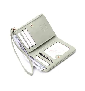 Interior detail of mint green women's short wallet with card slots and cash slot