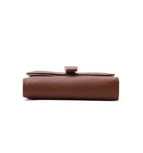 Detailed side view of a brown pebbled leather wallet featuring belt buckle closure