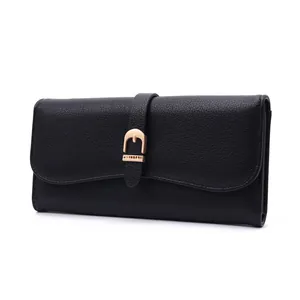 Close-up detail of a stylish black pebbled leather long wallet for women with gold buckle